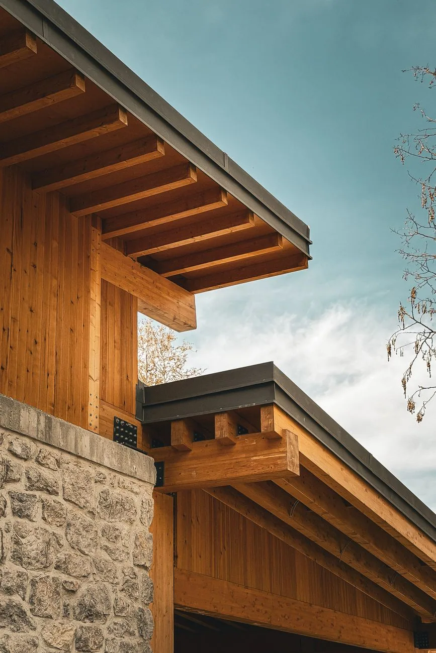 Exposed timber rafter tails stone wall metal fascia, Sanford